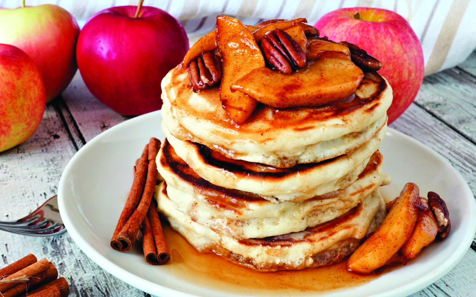 Autumn,Pancake,Stack,With,Baked,Apples,,Pecans,And,Cinnamon,Topped