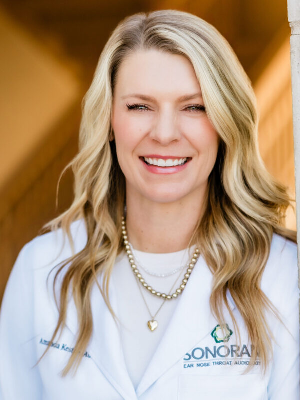 Amanda Kester, AuD smiling in her professional headshot