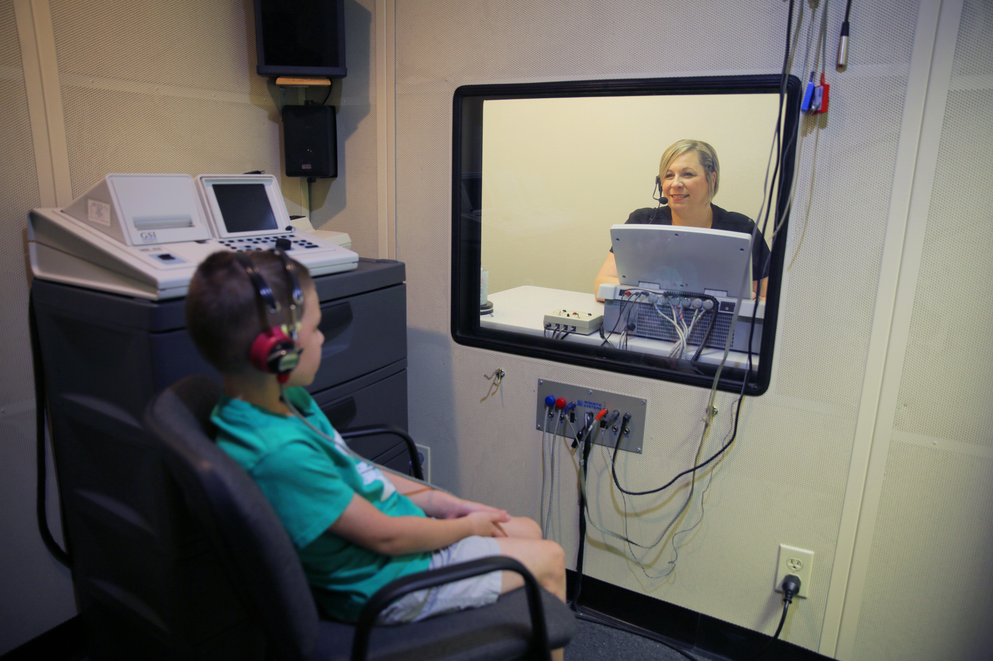 provider hearing evaluation and test with child patient