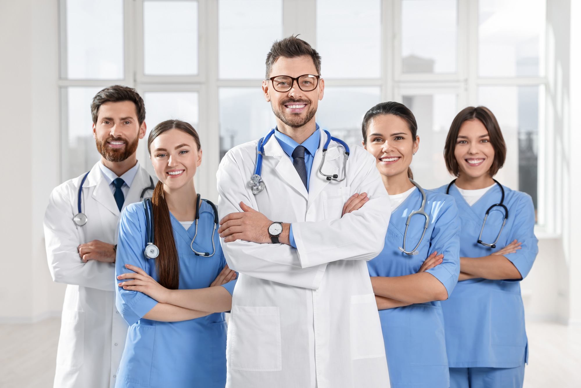 group of diverse doctors looking into camera posing smiling
