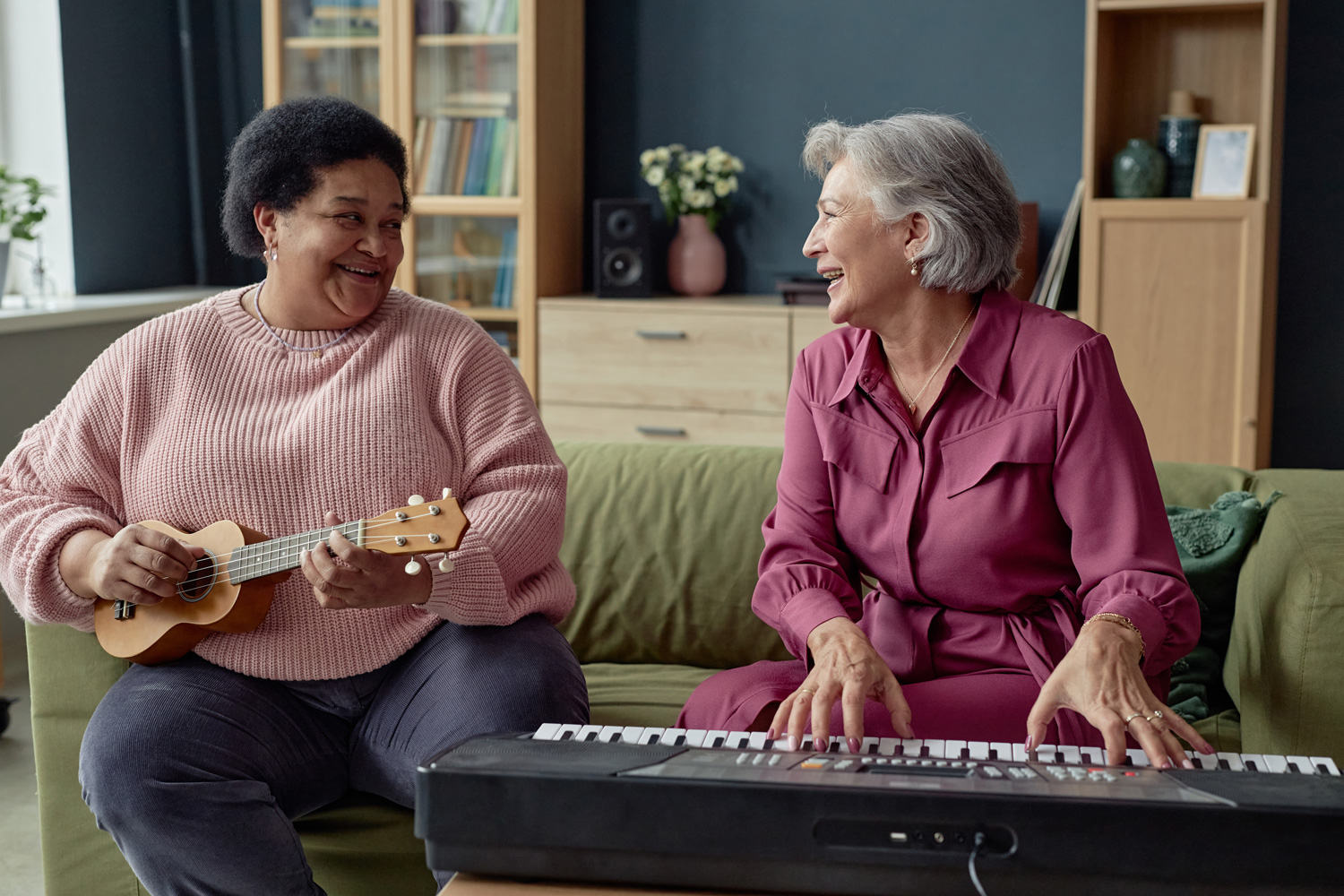 two older women playing musical instruments
