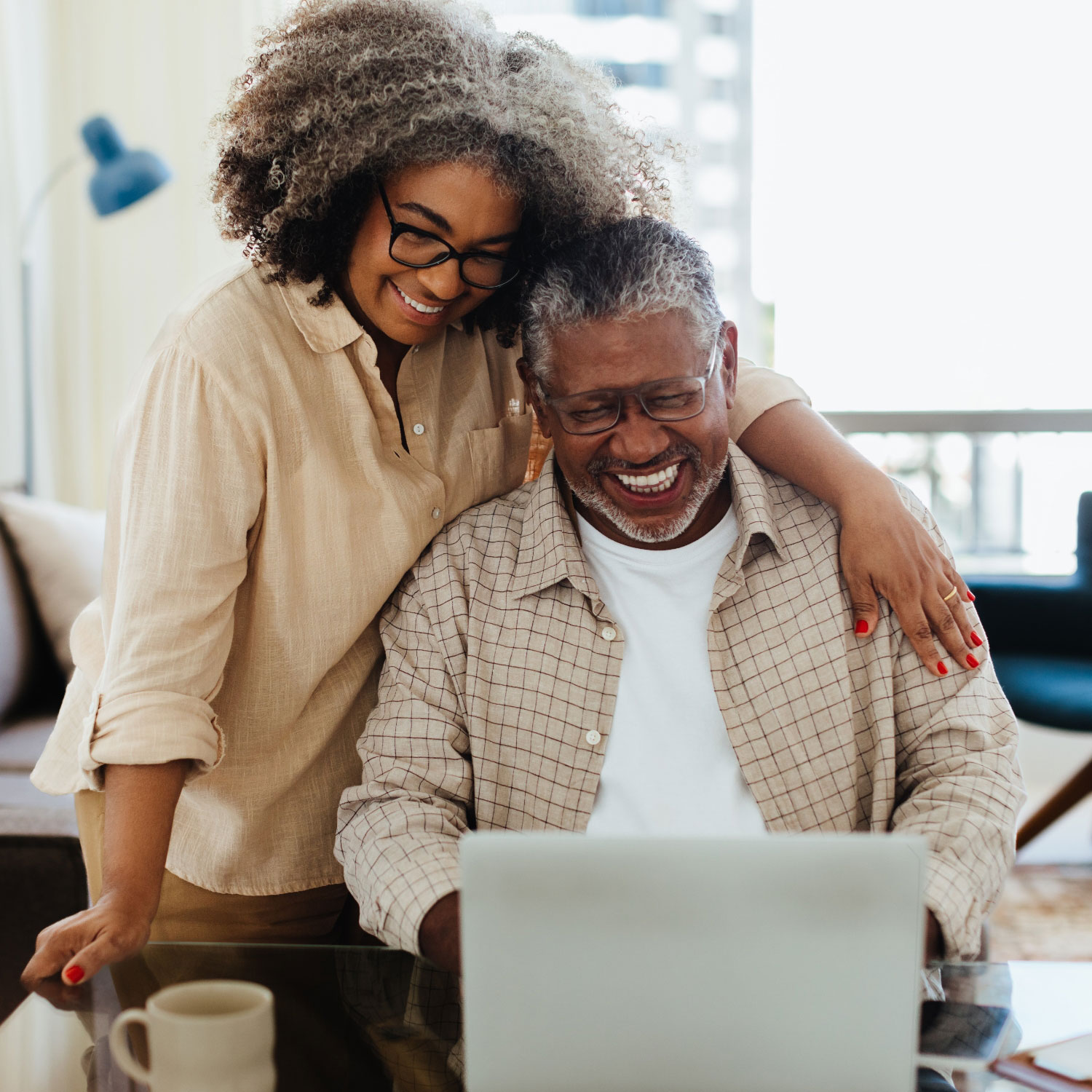 middle aged couple looking at laptop hearing resources square