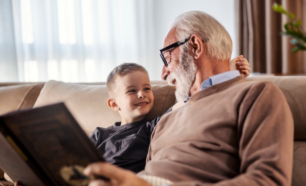 grandfather reading book grandson