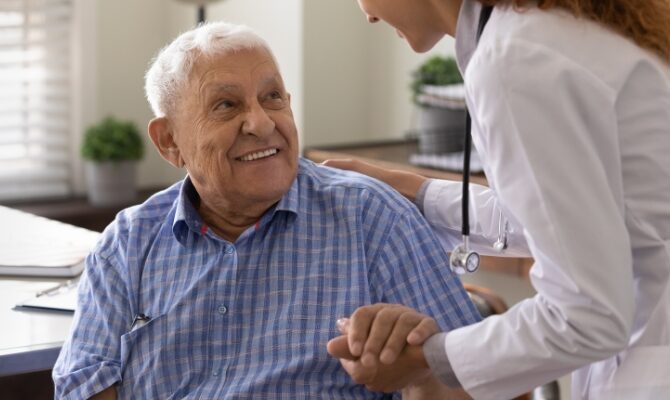 senior male during consultation with hearing provider