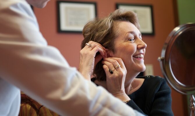 woman hearing aid try on