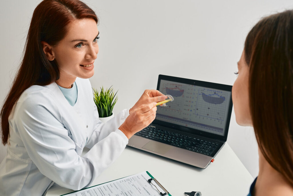 hearing provider explaing RIC hearing aid during aural rehab consultation