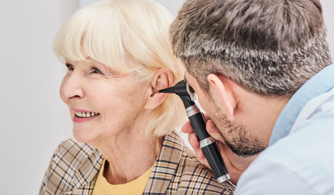 hearing specialist checking ear