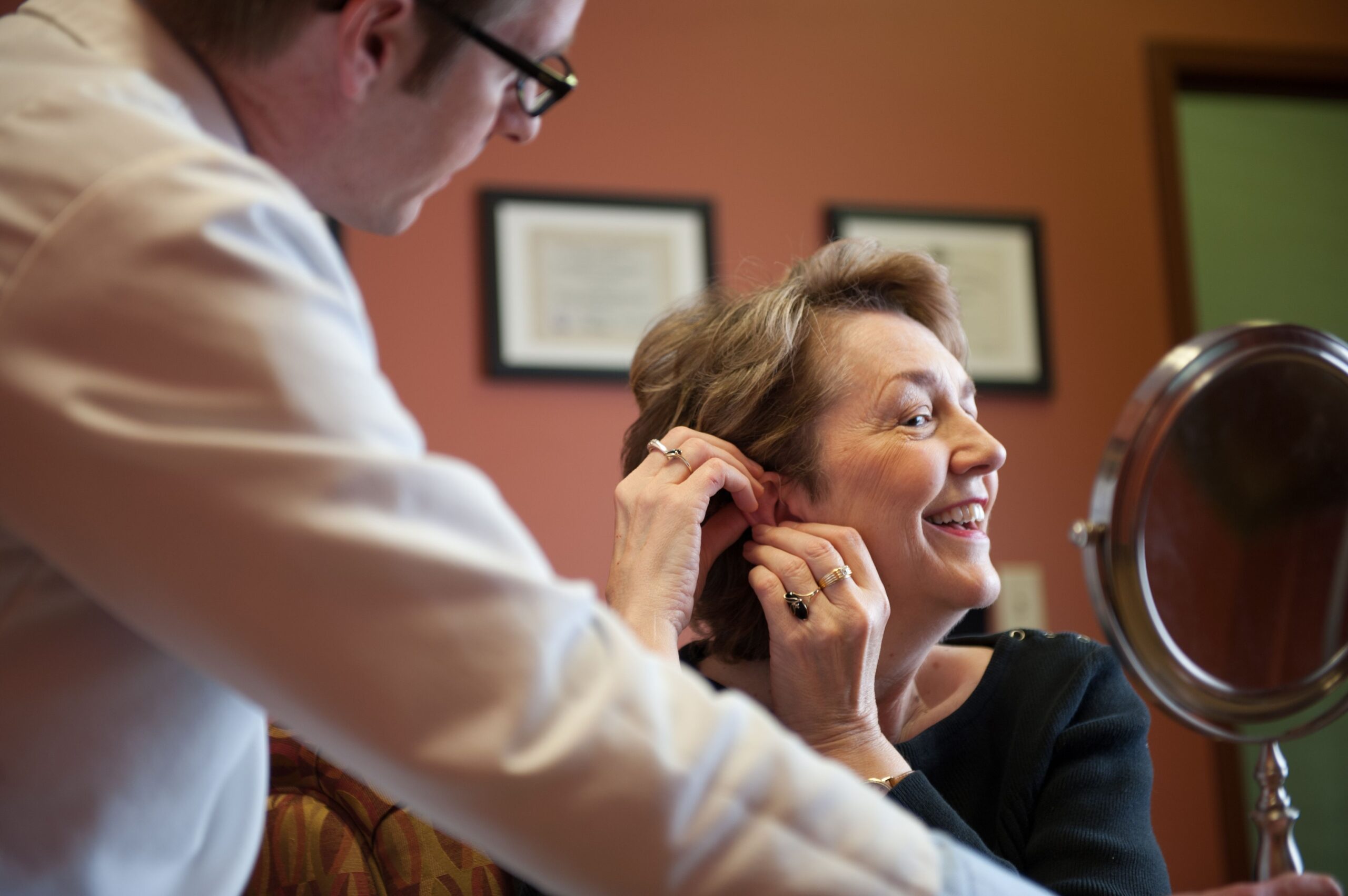 women hearing aid try on