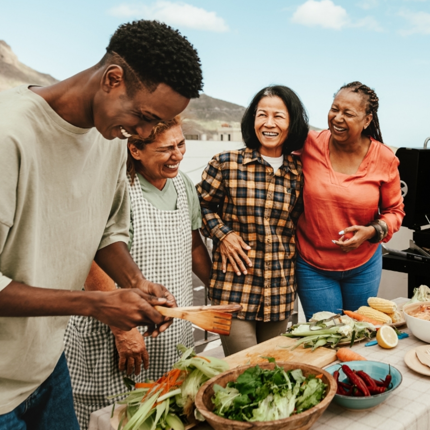 group of diverse friends having barbecue outside