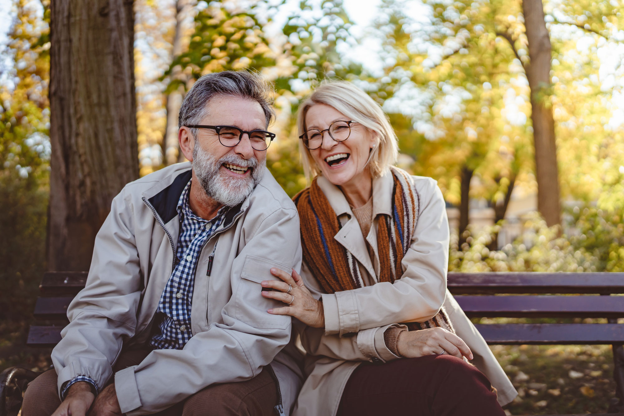 couple laughing outside park