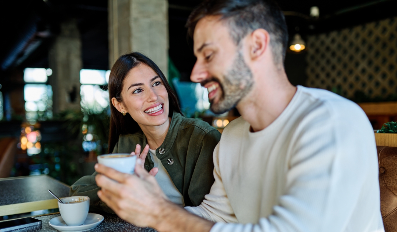 couple enjoying coffee at cafe