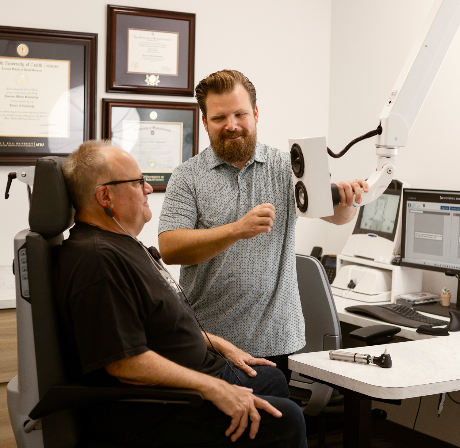 acoustic audiology terry sokalofsky preparing senior man for ear evaluation