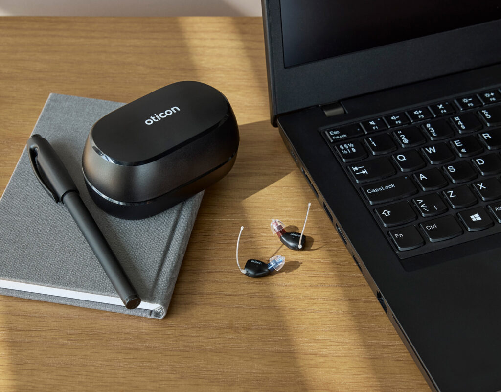 oticon zeal lifestyle charging case hearing aids by laptop