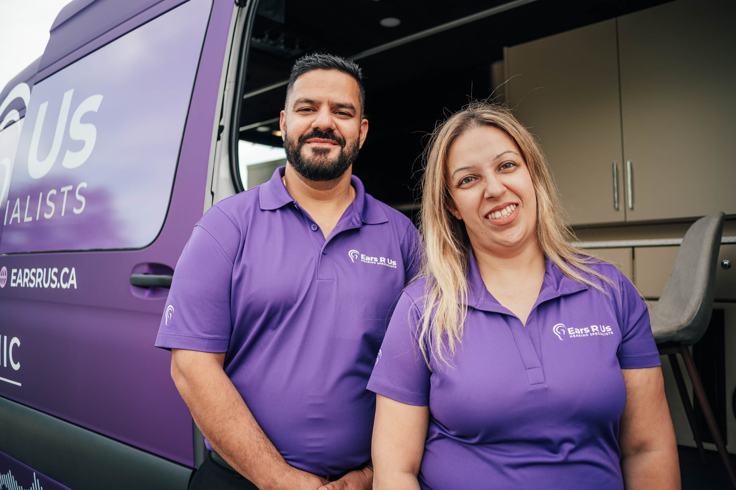 Ears R Us staff next to mobile van