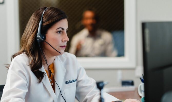 cta stacked hearing care provider performing hearing test