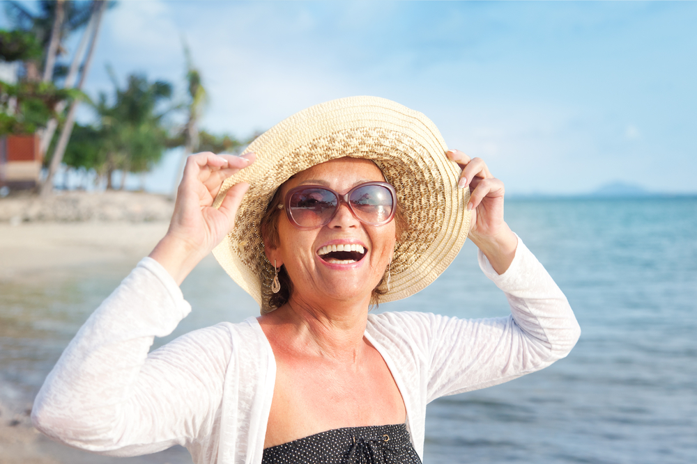 Happy,Mature,Woman,Of,50,Years,On,The,Beach