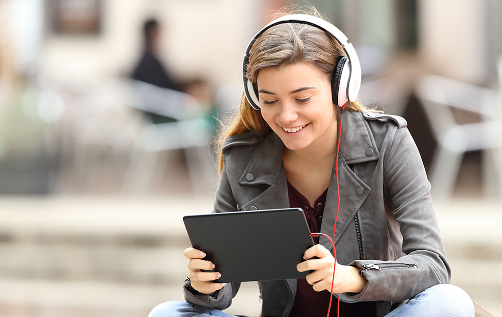 Girl with Tablet and Headphones