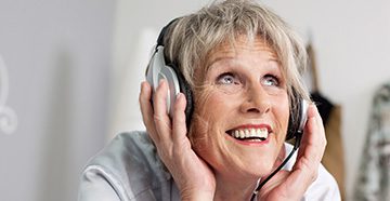 women-with-headphones-excited-cta