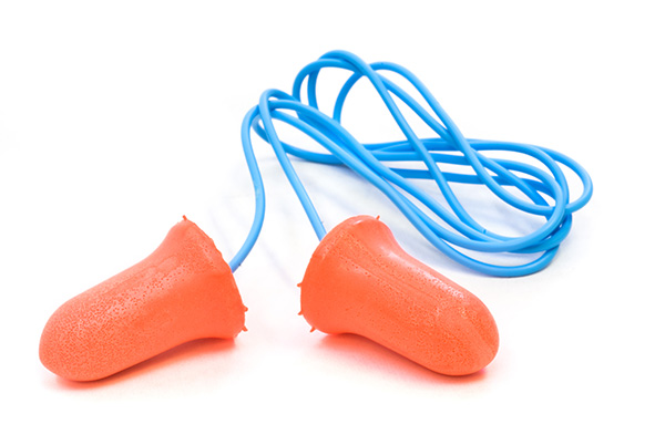 a pair of orange foam ear plugs