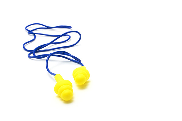 yellow earplugs with blue cord on white background
