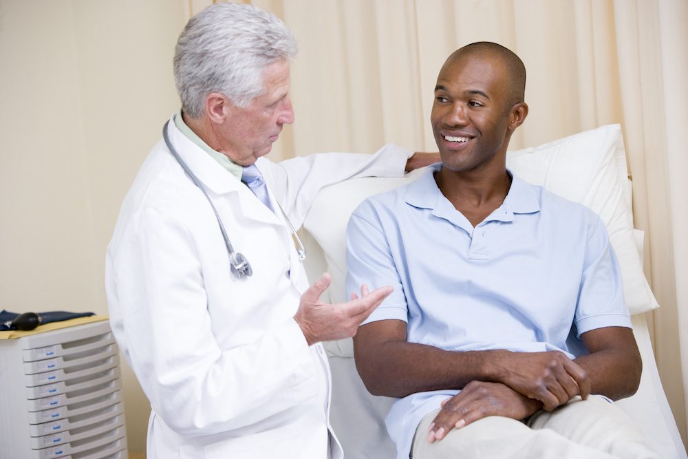 ent doctor with his patient in a medical bed