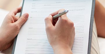 close-up-filling-out-paperwork