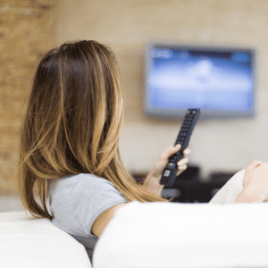 older woman on phone woman watching tv
