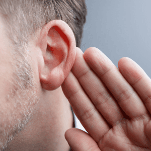older woman on phone hearing