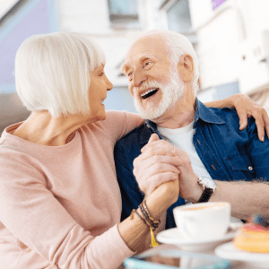 older woman on phone older couple holding hands