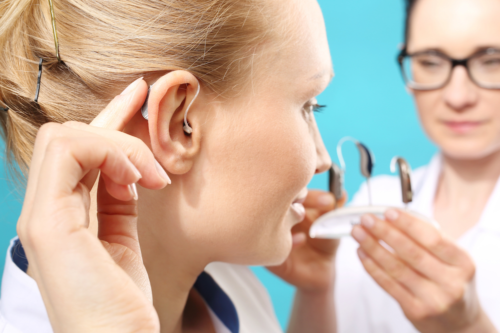 Woman with Hearing Aid Selection