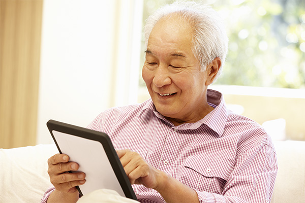 Elderly Man on Tablet