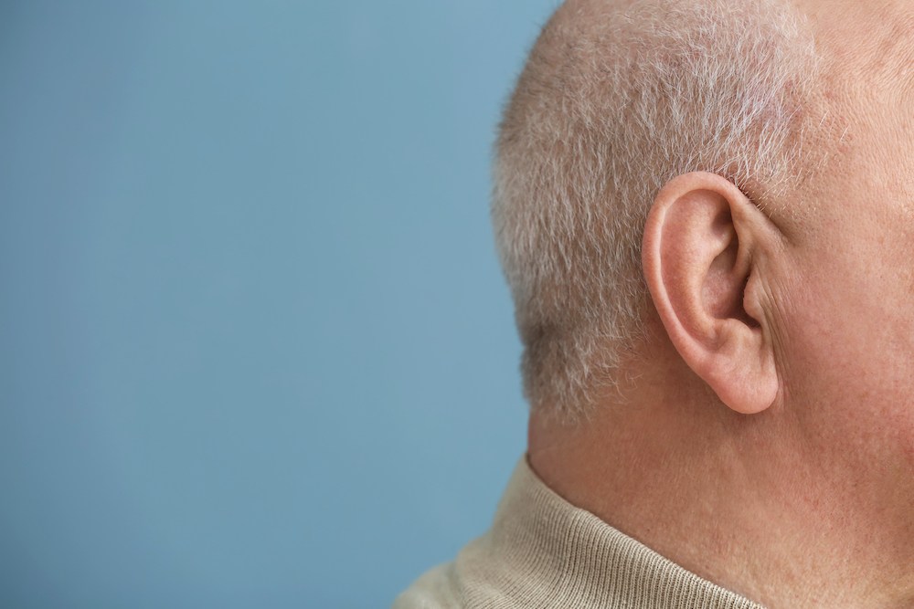 side of mans head and ear