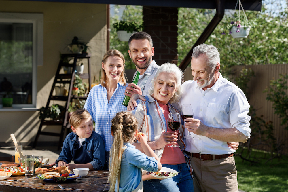 family talking together outside of their home