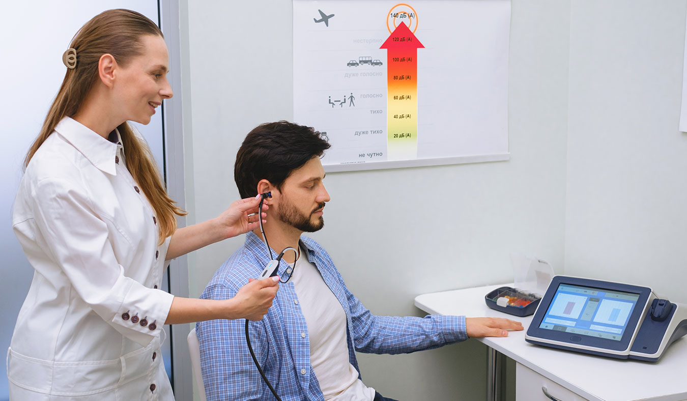 hearing tests with patients audiologist evaluating mans ear video exam