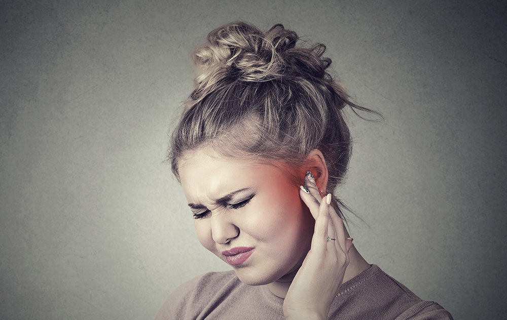 picture of woman with ringing in ears