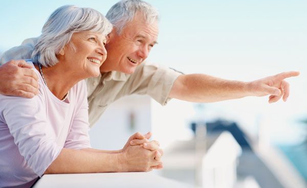 husband and wife smiling