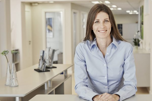 beltone woman at desk