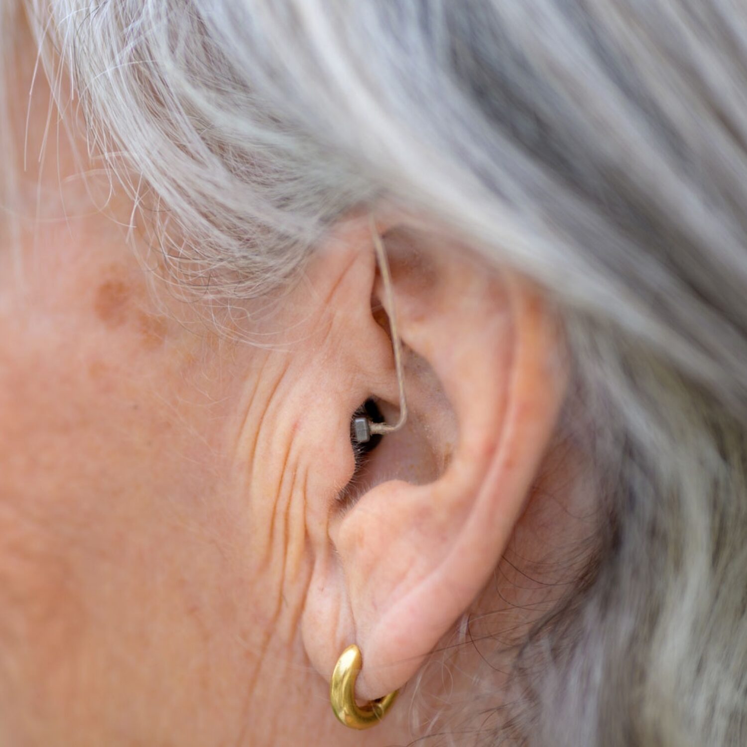 bte hearing aid closeup senior woman