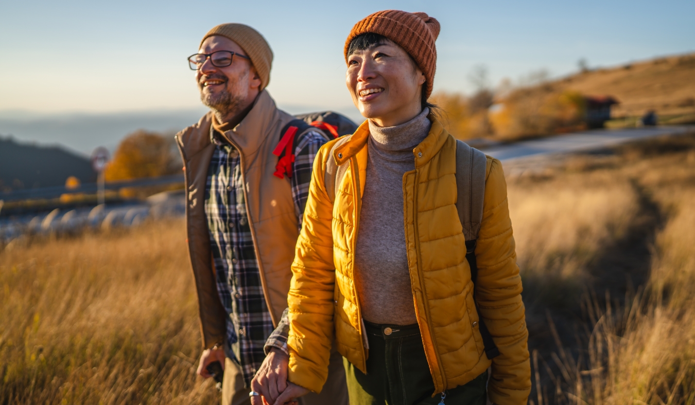 couple hiking in autumn landscape