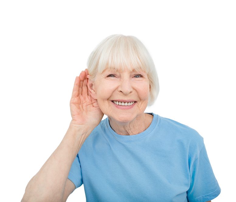 smiling patient cupping hand to ear