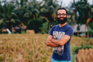 Man standing outside in short sleeves
