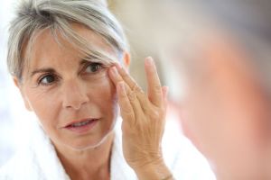 woman wiping her eyes from crying