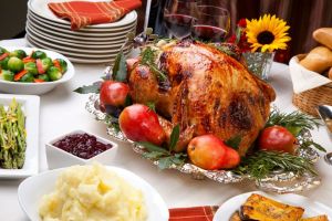 a Thanksgiving feast turkey and potatoes and cranberries