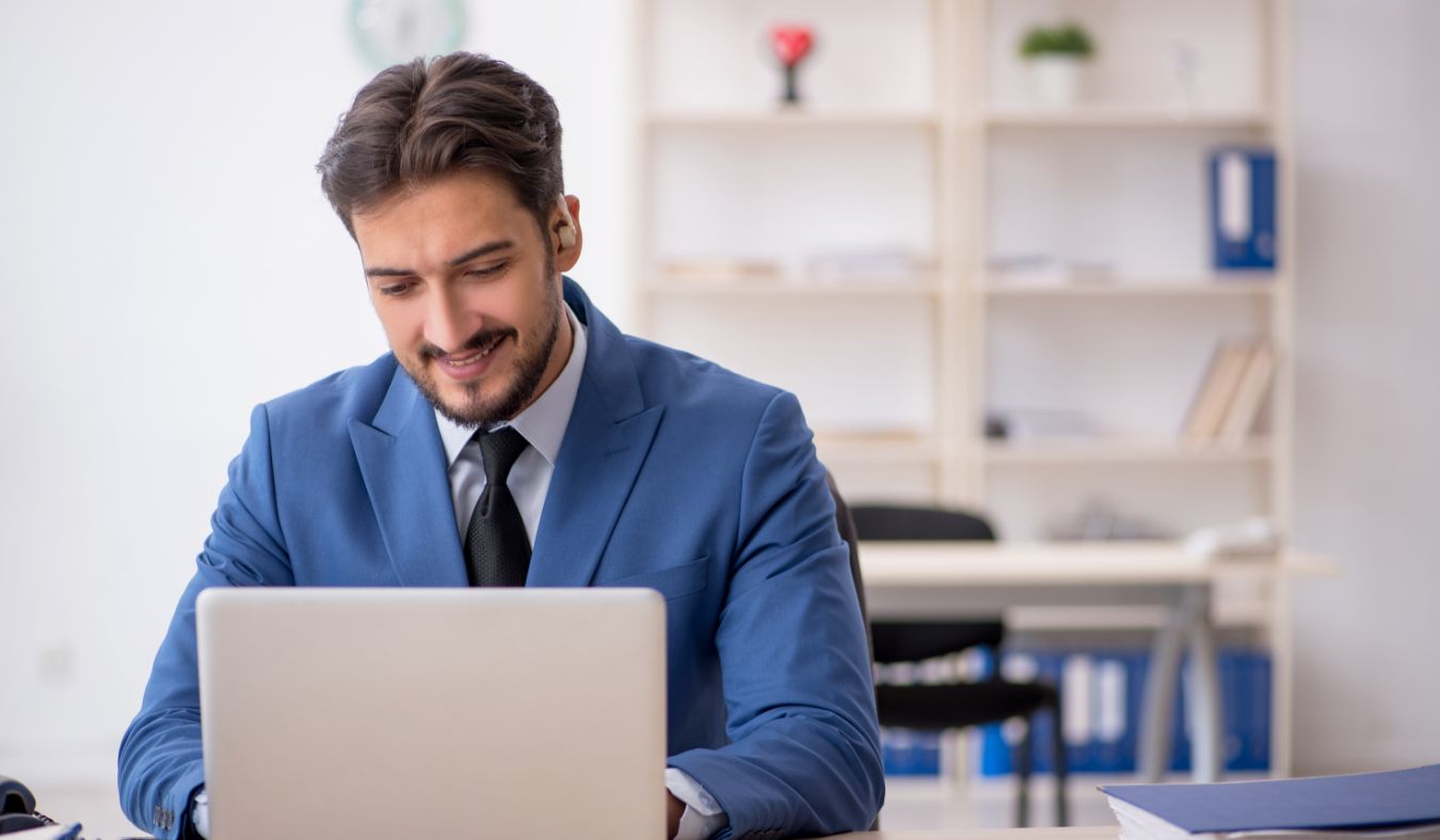 businessman hearing aids working