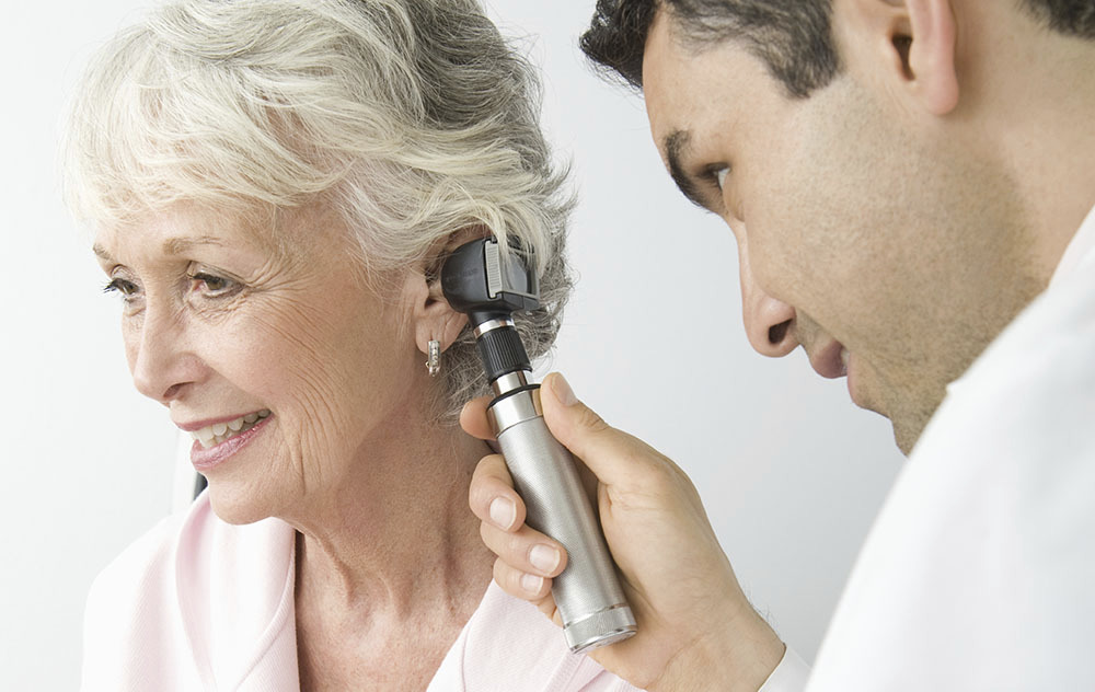 woman getting hearing checkup