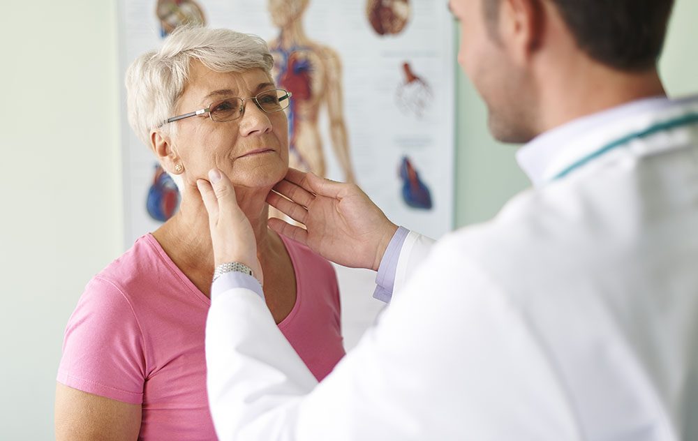 ent doctor examining throat area of his patient