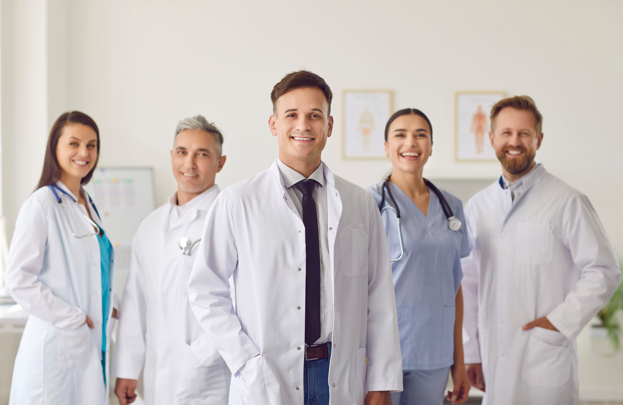 doctor standing in front of medical team
