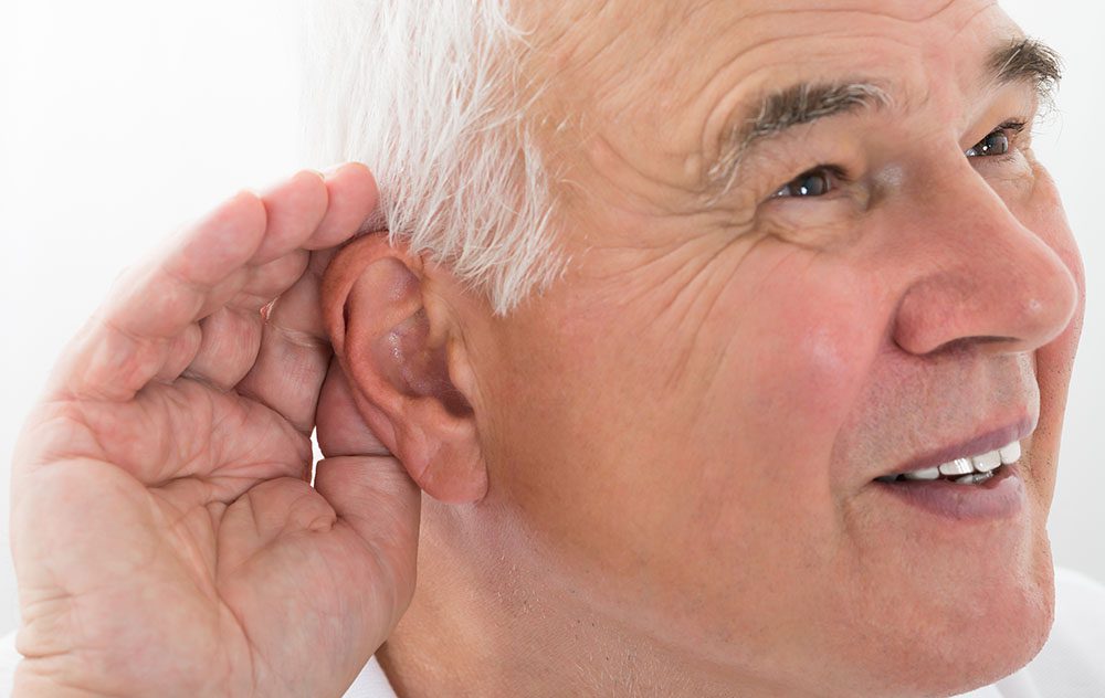old man cupping hand to ear