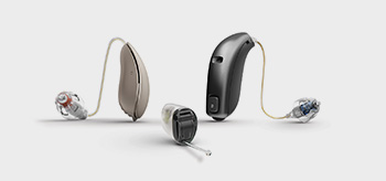 an audiologist checking out his patient's ears