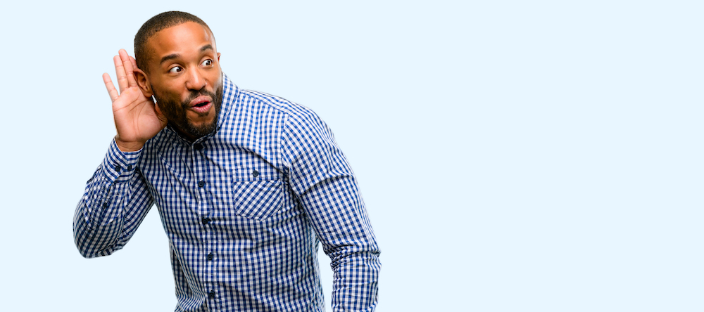 goofy man struggling to hear well